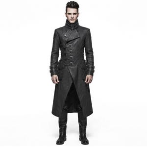 May include: A long black coat featuring a high collar with a buckle strap, a double-breasted front closure with multiple horizontal buckle straps, long sleeves with buckled cuffs, and two large side pockets, all crafted in a dark, textured material.