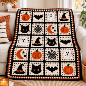May include: A rectangular crochet blanket featuring a grid of square motifs with Halloween-themed designs including orange pumpkins, black cats, white ghosts, black bats, spider webs, witch hats, and orange crescent moons on a black background.