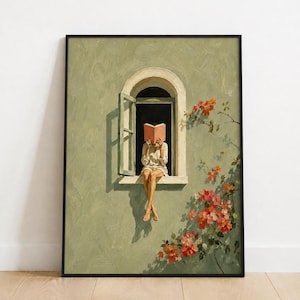 May include: A framed wall art print depicting a person sitting on a window ledge, reading a pink book. The scene features a sage green wall, an open arched window, and a climbing plant with orange and pink flowers, all rendered in an oil painting style.