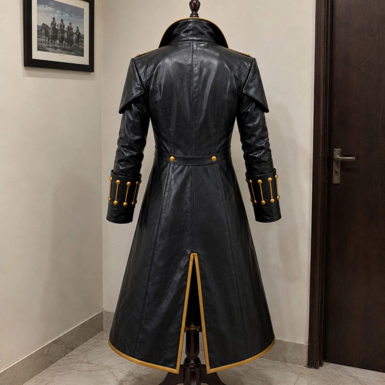 black leather coat with gold trim high stand collar front button closure and full length gothic outerwear design