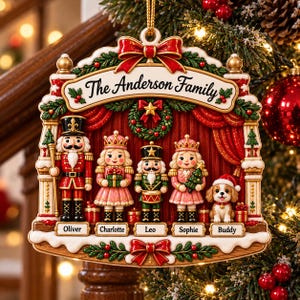 May include: A decorative Christmas ornament featuring a stage design with red curtains and a wreath. It displays five figures: a nutcracker, two princesses, a drummer, and a puppy. The text reads The Anderson Family, Oliver, Charlotte, Leo, Sophie, and Buddy.