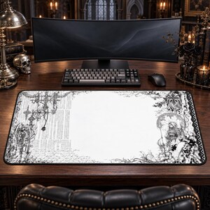 May include: A rectangular desk mat featuring a white centre and black intricate gothic-style illustrations on the left and right sides, including ornate crosses, floral patterns, and script text, with a black stitched border edge.