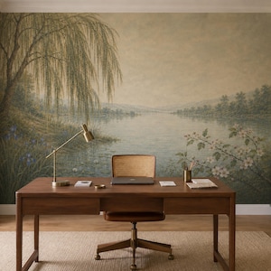 May include: A wall mural featuring a landscape painting of a weeping willow tree by a lake, with a wooden desk and a cane-back chair positioned in front. The mural displays soft green, brown, and beige tones, depicting a serene water scene.