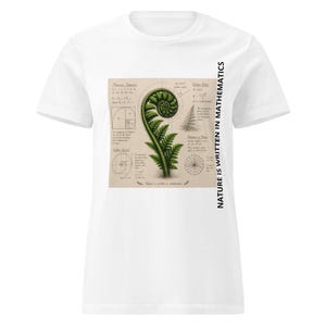 May include: A white t-shirt featuring a central graphic of a green fern frond surrounded by mathematical diagrams, including the Fibonacci sequence and golden ratio, with the text "NATURE IS WRITTEN IN MATHEMATICS" printed vertically on the right side.