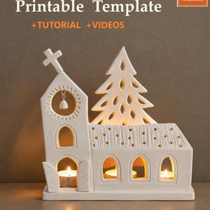 May include: A white ceramic church-shaped candle holder featuring a steeple with a cross, a bell, and an adjacent pine tree cutout. The structure has arched windows and open doors, with small gold-colored dots on the roof. Text reads: Printable Template +TUTORIAL +VIDEOS and CTS.