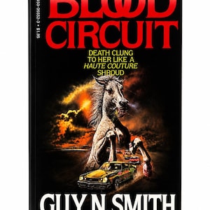 May include: A paperback book titled Blood Circuit by Guy N. Smith. The black cover features a rearing horse with bared teeth above a yellow car on a dark road. The text reads: Death clung to her like a haute couture shroud. The ISBN is 0-450-05552-3.