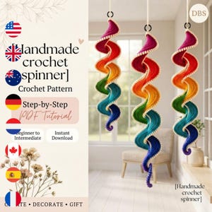 May include: Three hanging crochet spinners featuring a vibrant rainbow gradient of red, orange, yellow, green, blue, and purple yarn. Each spiral ornament is suspended by a white cord from a black ring, showcasing a detailed, textured stitch pattern.