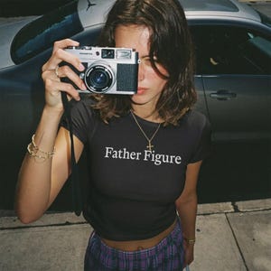 Father Figure Baby Tee | Funny Graphic Crop Top | Y2K Trendy Statement Shirt | Vintage Inspired Coquette Tee | Feminine Fitted Graphic Top