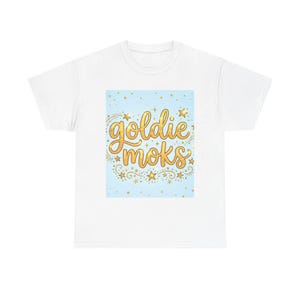 Goldie Moks script graphic Tee | gold lettering, stars, swirls