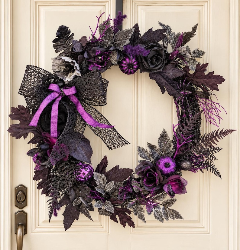 Black and purple gothic Halloween wreath with glitter pumpkins and spider webs
