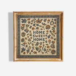 May include: A square wall art piece in a light wood frame featuring a mosaic-style design with a cream background, blue and orange floral patterns, and the text HOME SWEET HOME centered in dark blue letters within a decorative geometric border.
