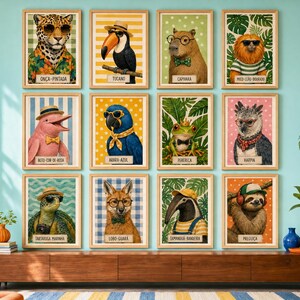 May include: A gallery wall display of twelve framed rectangular prints featuring anthropomorphic animals wearing accessories like hats and glasses. Each print includes a label with the animal's name in Portuguese, such as Onça-Pintada, Tucano, and Capivara.
