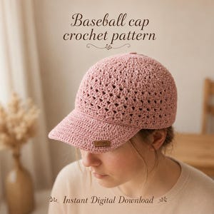 May include: A dusty pink baseball cap made with a textured crochet stitch pattern. The cap features a solid brim and a small rectangular brown label on the side. The text "Baseball cap crochet pattern" and "Instant Digital Download" appear above and below.