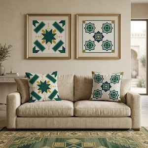 May include: Two square throw pillows and two matching framed wall art prints featuring geometric patterns in shades of dark green, navy blue, and mustard yellow on a cream background, displayed on a beige upholstered sofa in a living room.