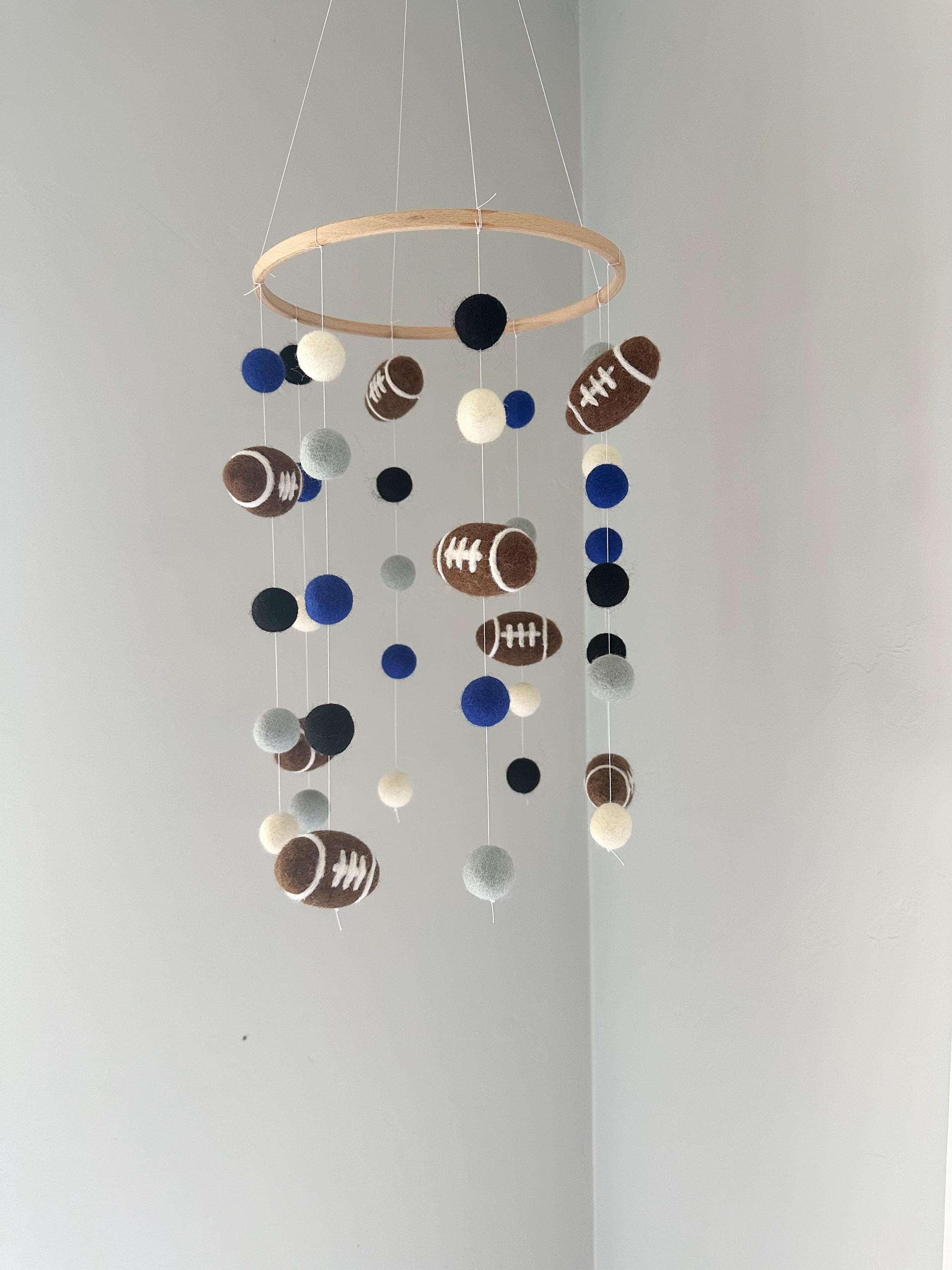 football helmet baby mobile Sports Musical Baby Crib and basketball) and a soft 5 plush lion made from a sandy And just like that, he's
