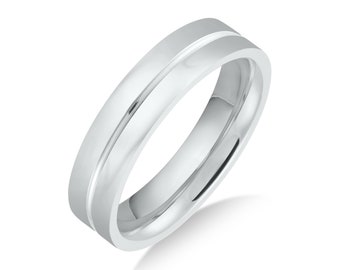 May include: A simple silver wedding band with a single, thin groove around the center.