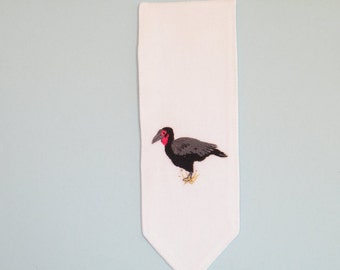 Hand embroidered  Southern Ground Hornbill bird on a white cotton bookmark.