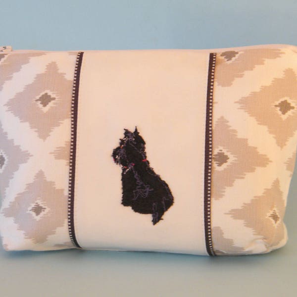 Scottish Terrier embroidered with freehand machine stitching on a grey and white zippered cosmetic bag