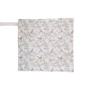 May include: A square piece of fabric with a repeating pattern of blue birds on green leafy branches. A white strap is attached to the top left corner. The fabric has an off-white background and a vintage aesthetic.
