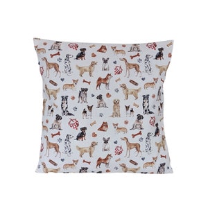 May include: White pillowcase with a repeating pattern of various dog breeds in watercolor illustrations. The dogs are in different poses and colors, including brown, black, white, and tan. The background is white with small brown paw prints and bone shapes.