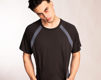 Minimalist raglan sleeve t shirt in charcoal gray with sporty blue accent