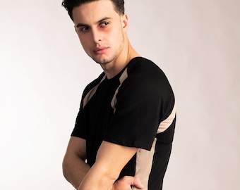Mens sporty minimalist black raglan sleeve t shirt with beige stripes made from organic cotton