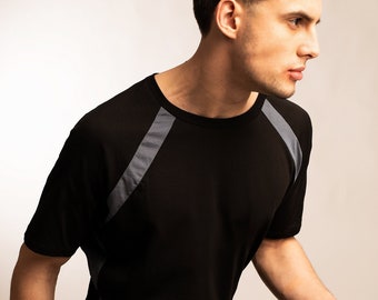 Mens futuristic punk black raglan sleeve t shirt with blue accent stripes made from organic cotton