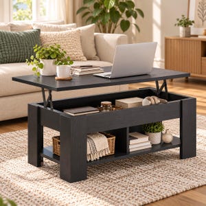 May include: A black wooden lift-top coffee table with a rectangular surface, featuring an internal storage compartment and a lower open shelf. The table holds a silver laptop, a white mug, and books, with a woven basket and decor on the shelf.