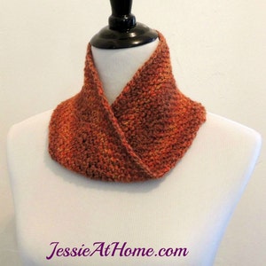 May include: A crocheted cowl in shades of orange and brown. The cowl is folded over and has a simple, elegant design.