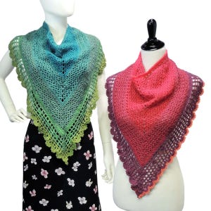 May include: Two crocheted shawls, one in shades of green and blue, the other in shades of pink and purple. Both shawls have a delicate lace border.