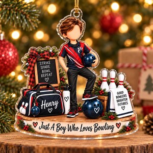 May include: A decorative acrylic ornament featuring a bowling theme with a boy character, a bowling bag labeled Henry, and a sign reading Strike Spare Bowl Repeat. The base text reads Just A Boy Who Loves Bowling and Good Bowlers Brighter Futures.