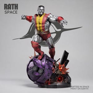 May include: A metallic silver-skinned figure with a muscular build, wearing a red and yellow bodysuit, stands atop a damaged purple robotic head. The text RATH SPACE appears in the top left, and CRAFTED IN SPACE PRINT ON EARTH is at the bottom right.