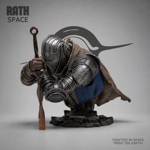 May include: A detailed bust of a knight in silver-toned plate armor, kneeling while holding a long sword. The figure wears a textured brown cloak over a blue tunic. The base is dark and rocky. Text reads RATH SPACE and CRAFTED IN SPACE PRINT ON EARTH.