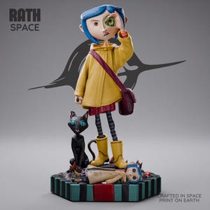 May include: A Coraline figurine with blue hair, a yellow raincoat, and a maroon bag, holding a green button over one eye. A black cat stands beside the figure, and a second Coraline figure lies on the base. Text reads RATH SPACE and CRAFTED IN SPACE PRINT ON EARTH.
