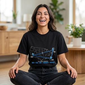 May include: A black short-sleeved t-shirt featuring a white outline map of the United States with a blue triangular flight path connecting VNY, TEB, and OPF locations. The text reads THE USUAL TRIANGLE and VNY > TEB > OPF > THERAPY > REPEAT.
