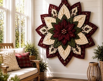 May include: A large, star-shaped quilted wall hanging featuring a layered poinsettia design. The fabric petals alternate between deep red, forest green, and cream colors with intricate stitching, centered with small gold-toned decorative beads.