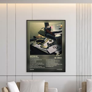 May include: A rectangular wall poster featuring the Section.80 album cover by Kendrick Lamar. The artwork displays a dark, cluttered desk with a gold chain and a prescription bottle. Below the image, the tracklist and album details are printed.