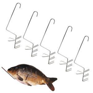 May include: Five silver-coloured metal fish hooks with long stems and curved top handles. Each hook features a three-pronged base designed to pierce and hold a whole fish. One hook is shown inserted into the side of a brown and grey fish.