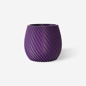 May include: A deep purple planter with a rounded, bulbous shape and a textured exterior featuring diagonal, spiralling grooves that wrap around the entire circumference of the vessel, creating a consistent pattern of ridges and valleys.