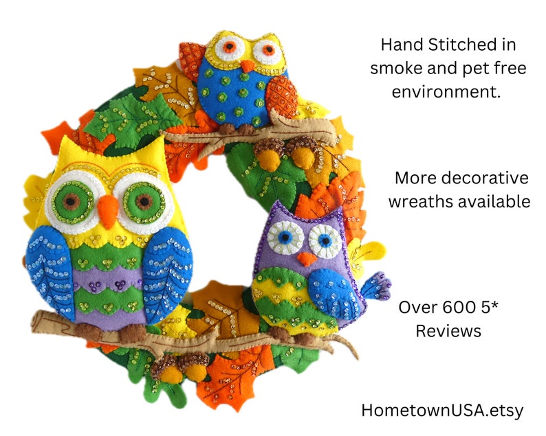 May include: A colorful felt owl wreath with three owls, one yellow, one blue, and one purple, with sequins and beads. The wreath is decorated with felt leaves in shades of orange, yellow, and green. The text "HometownUSA.etsy" is visible in the bottom right corner.