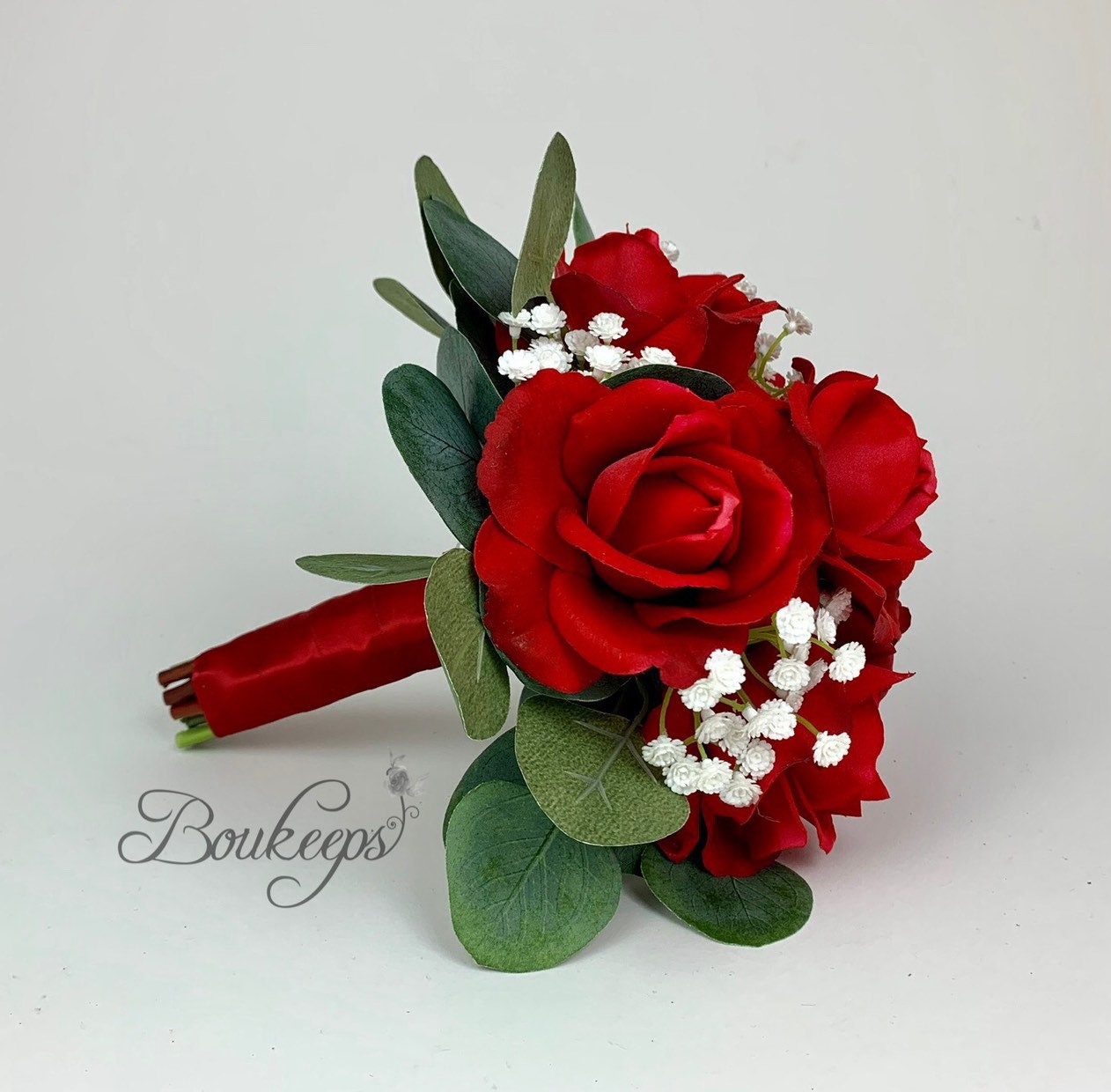 red rose bridal bouquet with diamond head pins,white ribbon and babies  breath.