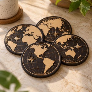 May include: A set of four circular coasters featuring a black background with a raised, tan-colored world map design. Each coaster displays a detailed map of different continents, thin longitudinal and latitudinal grid lines, and a compass rose.