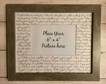 May include: A brown wooden picture frame with a white mat and a printed lyric sheet inside. The lyrics are from a song about a girl. The frame has a space for a 6x4 inch picture. The text in the image reads: "I've got sunshine on a cloudy day When it's cold outside I've got the month of May Will I guess you'd say What can make me feel this way? My girl (my girl, my girl) Talkin' bout my girl (my girl) I've got so much honey the bees envy me I've got a sweeter song than the birds in the trees... Place Your 6" x 4" Picture here ... My girl (my girl, my girl) Talkin' bout my girl (my girl) I've got sunshine on a cloudy day With my girl (My girl) (Talkin' bout my"