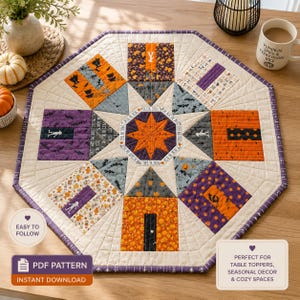 May include: An octagonal quilted table topper featuring a central orange star surrounded by house-shaped blocks in orange, purple, and gray fabrics with Halloween motifs including pumpkins, skeletons, and bats, finished with a dark purple binding.