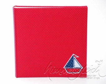 Photo album dots red with sailing boat