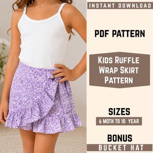 May include: A digital PDF pattern for a kids ruffle wrap skirt and bonus bucket hat. The text reads: INSTANT DOWNLOAD, PDF PATTERN, KIDS RUFFLE WRAP SKIRT PATTERN, SIZES 6 MOTH TO 10 YEAR, BONUS BUCKET HAT. The skirt is purple with a floral print.