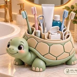 May include: A turtle-shaped bathroom organizer in light green and beige, featuring multiple compartments holding toothbrushes, a tube of toothpaste, a tongue scraper, dental floss, and small grooming tools. The shell serves as the storage unit.