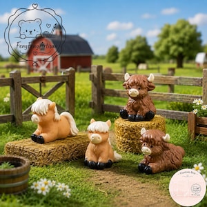 May include: Four miniature animal figurines featuring two light tan calves with white manes and two dark brown Highland cattle with white horns. The figures are positioned on small hay bales in a grassy field with a wooden fence and barn.