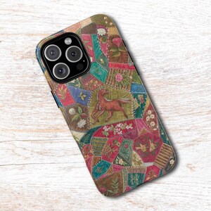 May include: A smartphone case featuring a colorful patchwork design with various floral patterns, geometric shapes, and a central illustration of a brown horse. The case has a black camera module with three circular lenses and a flash component.