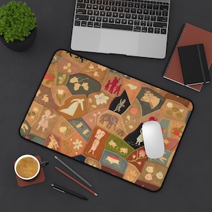 May include: A rectangular desk mat featuring a patchwork-style design with various earth-toned segments. The pattern includes illustrations of animals like an elephant, cow, and rabbit, alongside human figures, flowers, and leaves in muted colors.